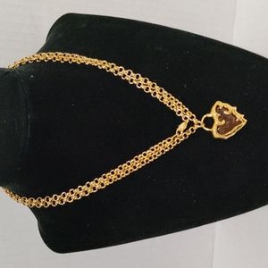 Gold tone necklace with heart pendant